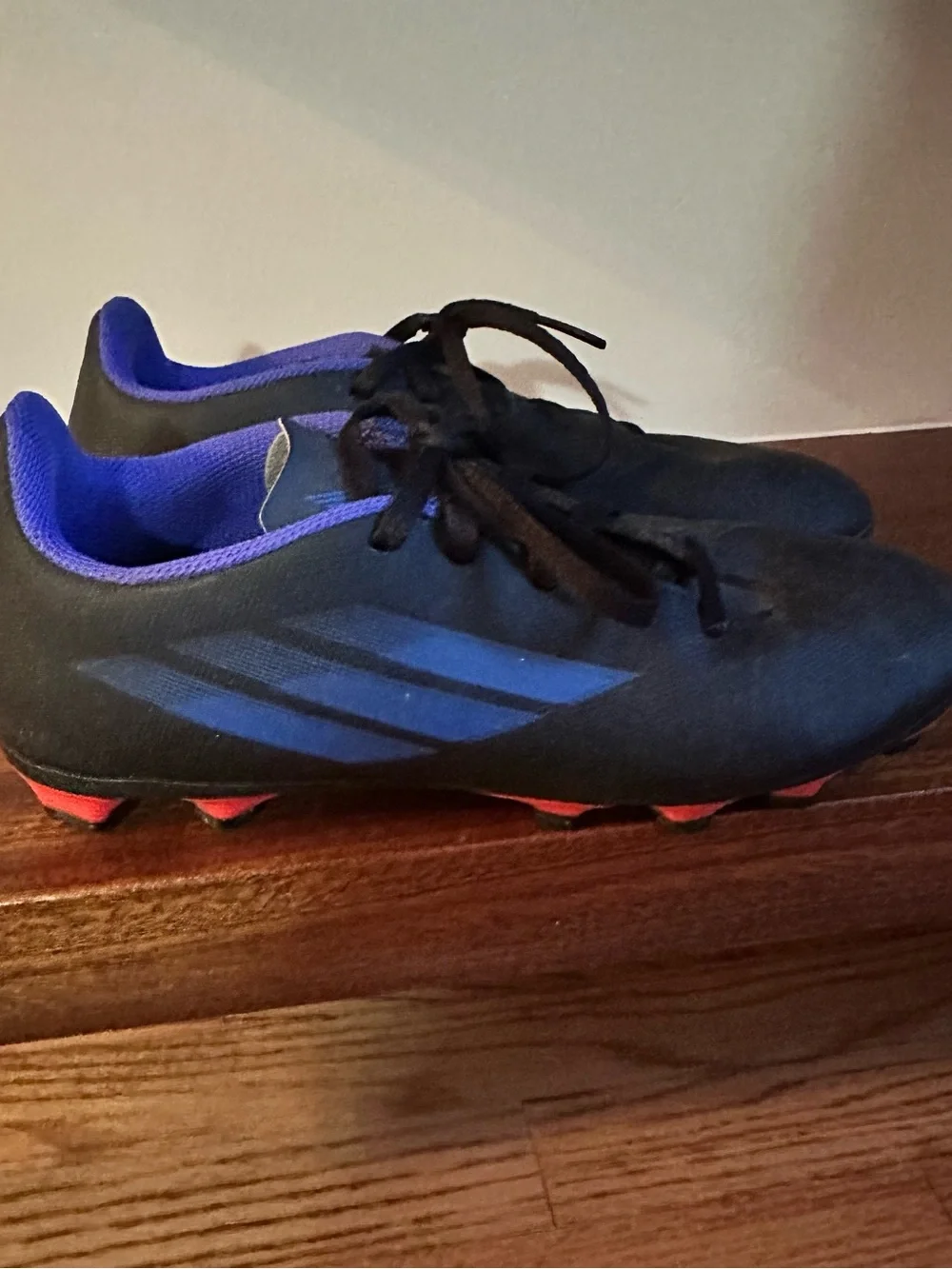 adidas Black Cleats with Blue Accents and Red Studs